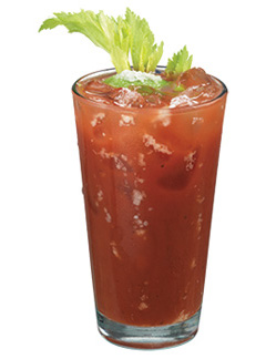 Bloody mary with tequila and celery in a tall glass.